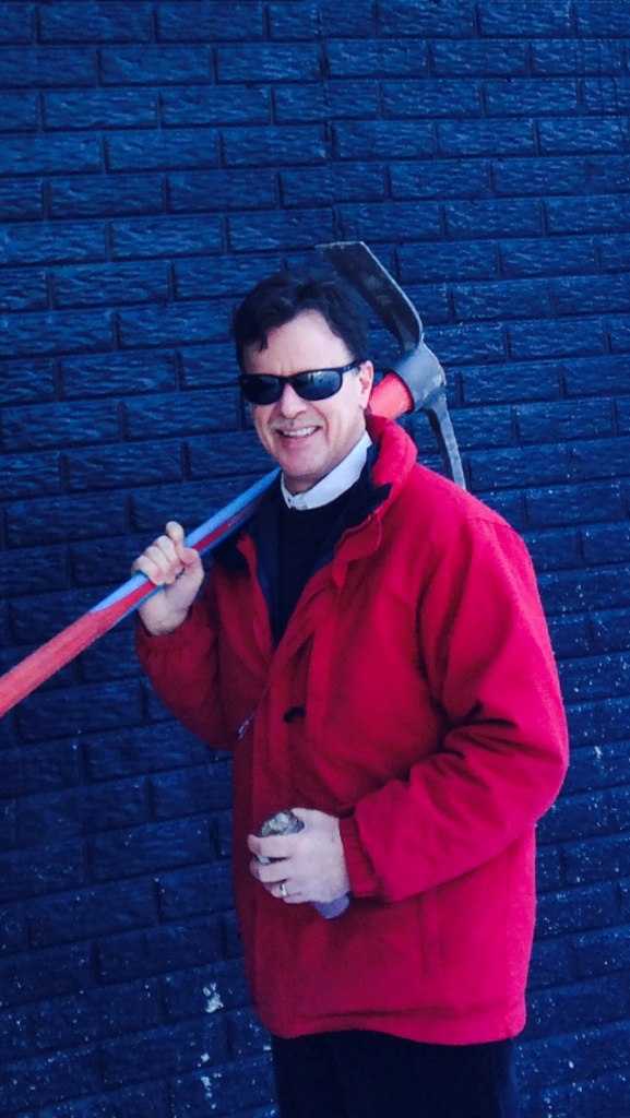 Mathew Norris holding a Mattock